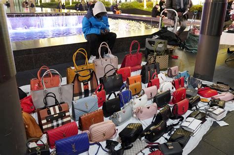 is it illegal to buy fake designer clothes|selling designer handbags illegal.